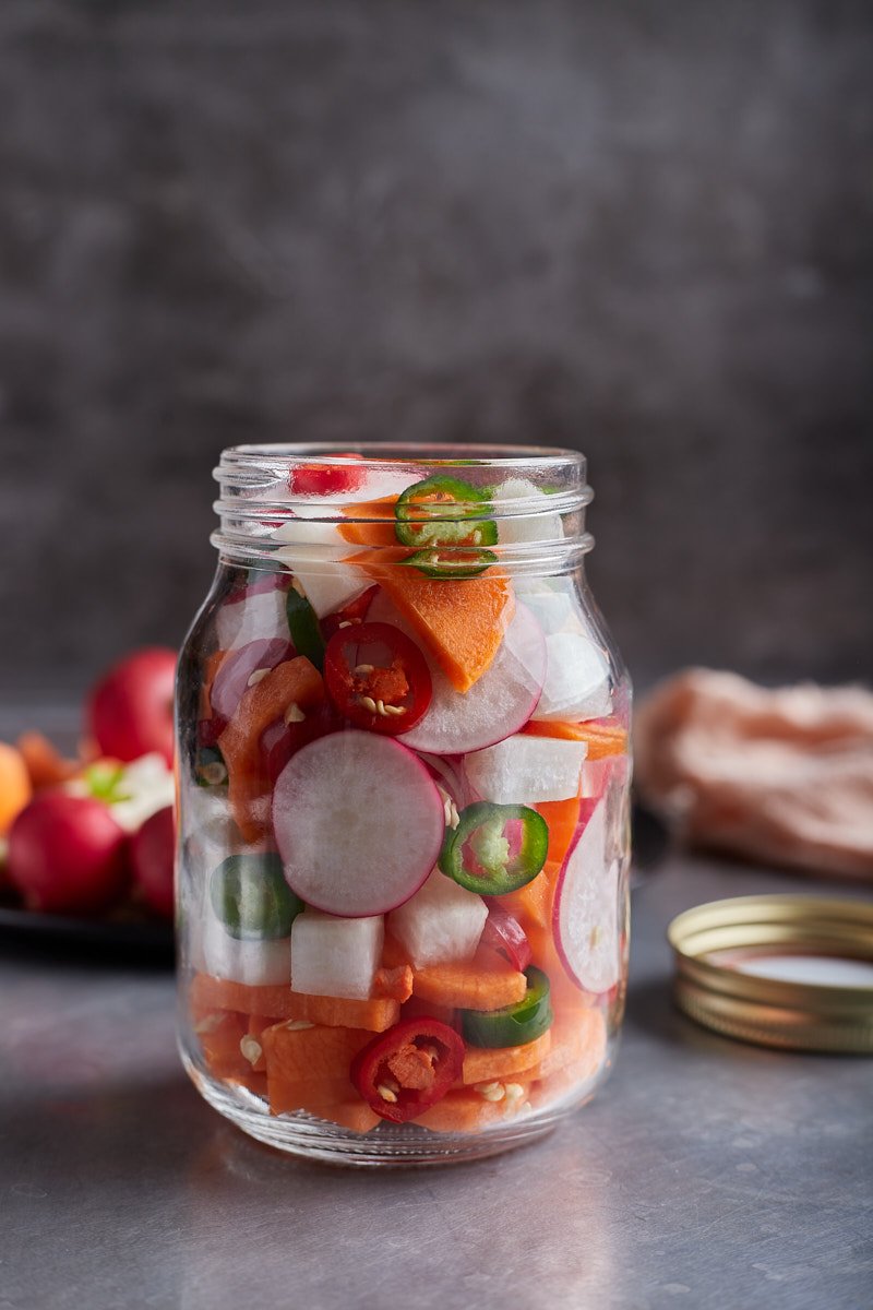 Add red chili and green chili or chop up some garlic cloves in jar.