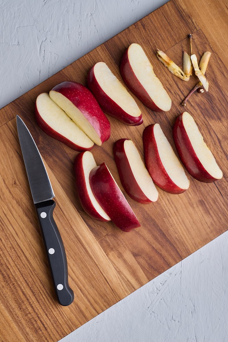 Peel and cut fruit int to slices.