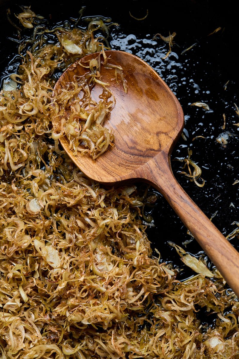 The thinly sliced lemongrass stir-fry crips up and light brown.