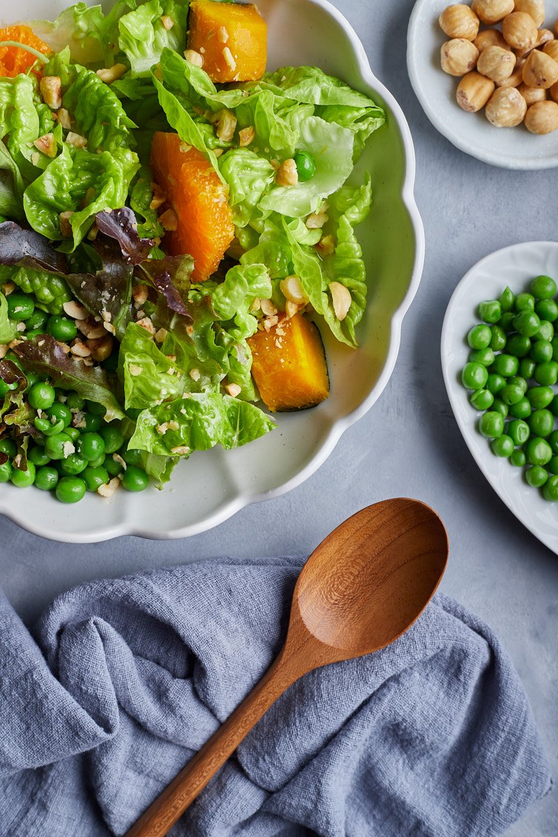 Delicious lettuce salad sprinkle with crunchy nuts.