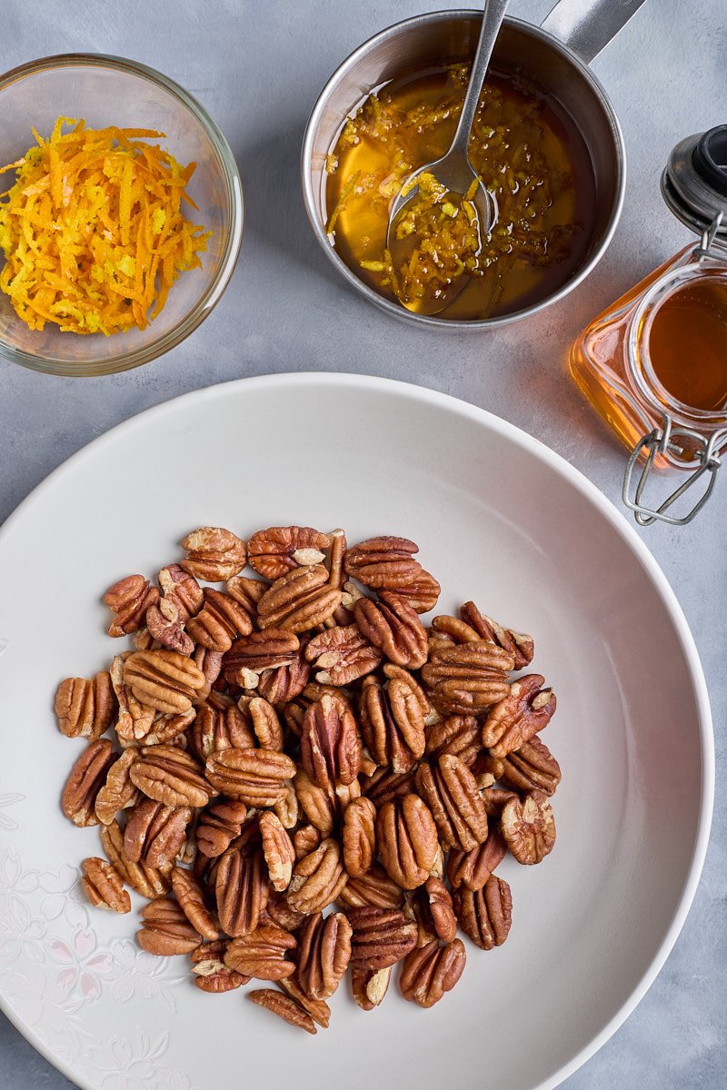 Stir syrup and transfer the nuts to the bowl.