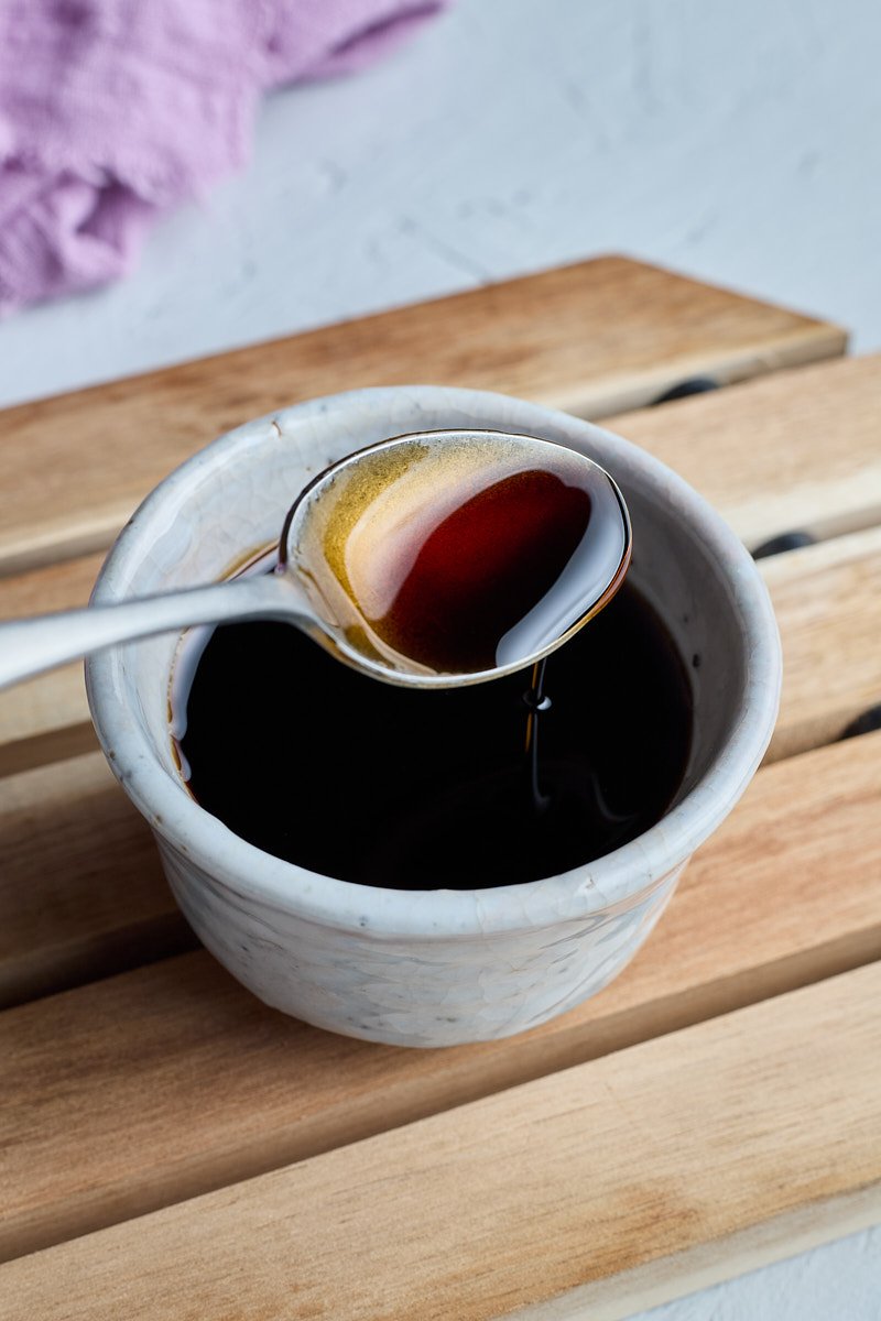 Black soy sauce is to give dish a dark rich brown color.